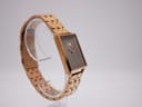 Oblique view of the MVMT Signature Square watch highlighting the minimalist dark brown dial and rose gold tone hands.