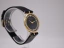 Another angled view of the Raymond Rone Premiere watch, showing the dial and side of the gold-plated case.