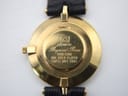 Close-up of the watch case back, showing 'Premiere', 'Raymond Rone', '1188-2188', '18K GOLD PLATED', and 'SWISS MVT 5000' engravings.