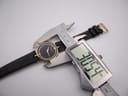 Digital caliper measuring the watch case diameter at 30.84 mm.