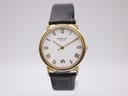 Front view of Raymond Weil 5542 gold tone watch with white dial and black roman numerals.