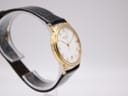 Another angled side view of the Raymond Weil watch, highlighting the case profile and fluted crown.