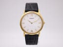 Front view of the Tissot C276K watch with gold-tone case, white dial, and black leather strap.
