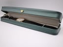 The Tissot watch placed inside a dark green presentation box with a gold crown emblem.