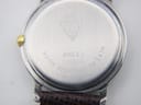 Close-up of the watch case back, showing the Gucci logo, model 8000.2 L, serial number 0035545, and 'water resistant to 3atm' engraving.