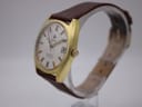 Angled side view of the Roamer Searock watch, showing the gold-toned case profile and crown.