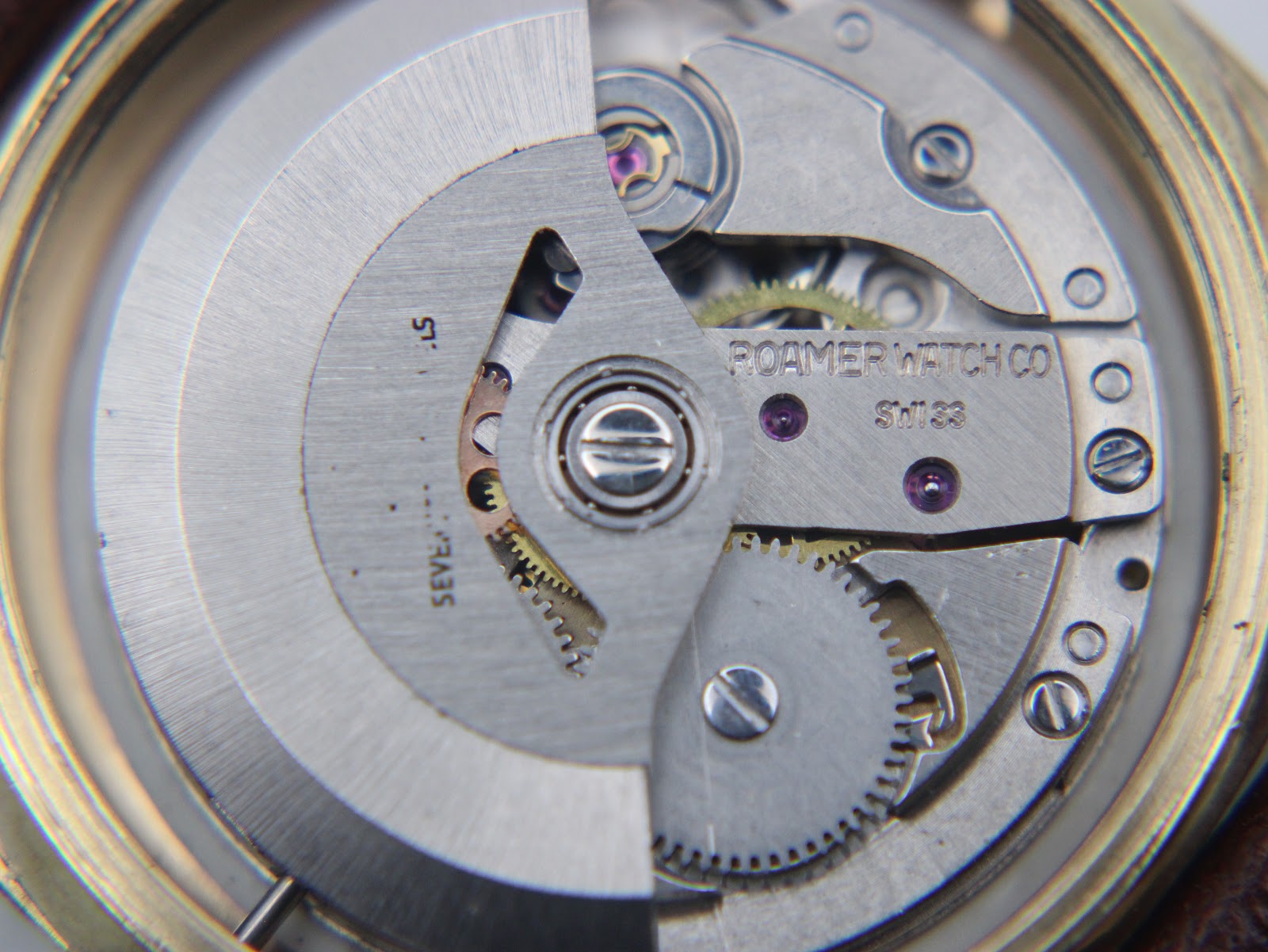Close-up view of the Roamer automatic movement, showing "Roamer Watch Co" and "Swiss".