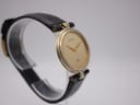 Close-up side view of the Gucci 4500 M crown, showing the embossed Gucci 'G' logo.