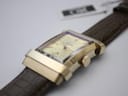 Close-up of the XO RETRO watch dial and case from an angle, showing the gold baton indices, hands, and the subtle texture of the cream dial.