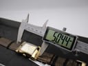 Digital caliper measuring the length (lug-to-lug) of the XO RETRO watch case at 50.44mm, showing the watch inside its box.