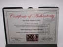 Certificate of Authenticity for the XO RETRO Automotive DNA watch, dated August 12, 2011, detailing that it contains metal recovered from a 1950's Rolls Royce Silver Wraith.