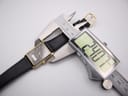 A digital caliper measuring the case width of the Seiko watch, with the display showing "24.77mm".