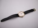 Full length view of the Roamer Searock watch and black leather strap on a white background.
