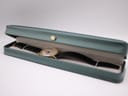 The Roamer Searock watch displayed inside an open green presentation box with a cream interior.
