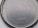 Inner view of the case back showing the serial number '22142'.