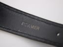 Underside of the black leather strap showing 'ROAMER' branding.
