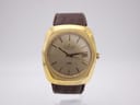 Front view of the Certina 288 automatic watch with a gold cushion case, champagne dial, brown leather strap, and date window.