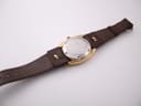 Back view of the Certina 288 watch, showing the stainless steel case back and the full brown leather strap.