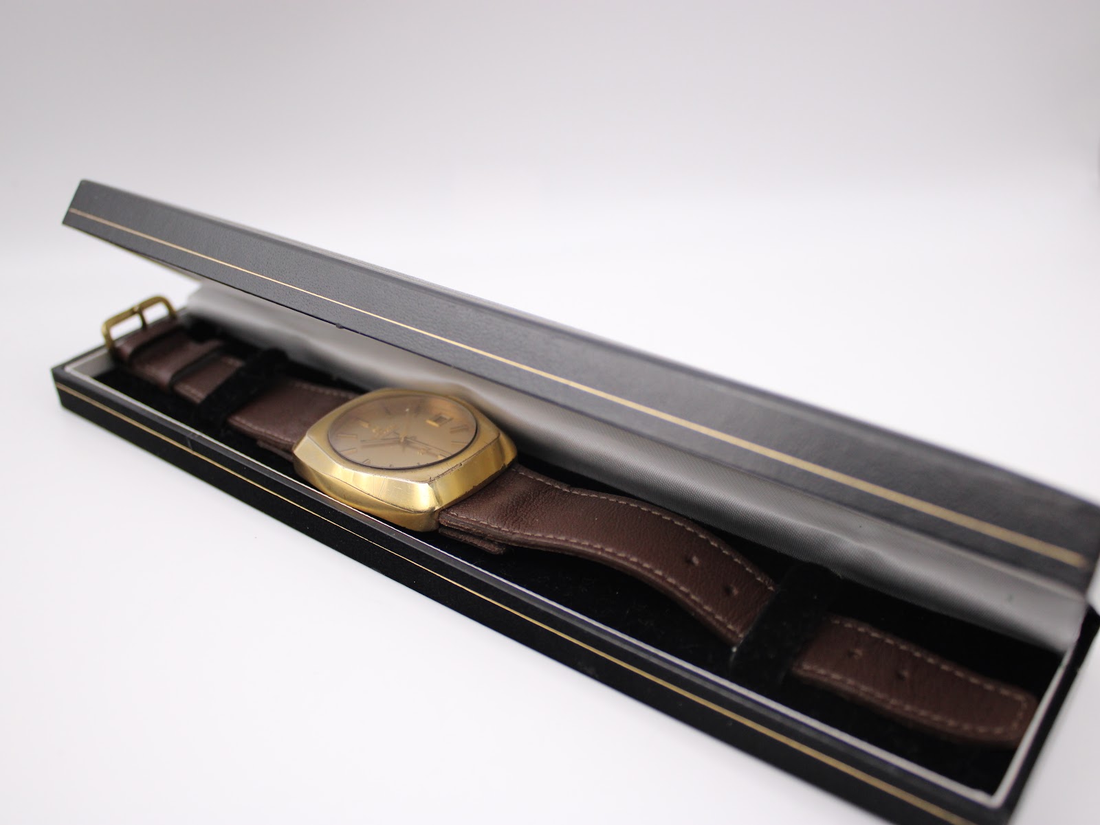 The Certina 288 watch neatly placed inside a black watch presentation box.