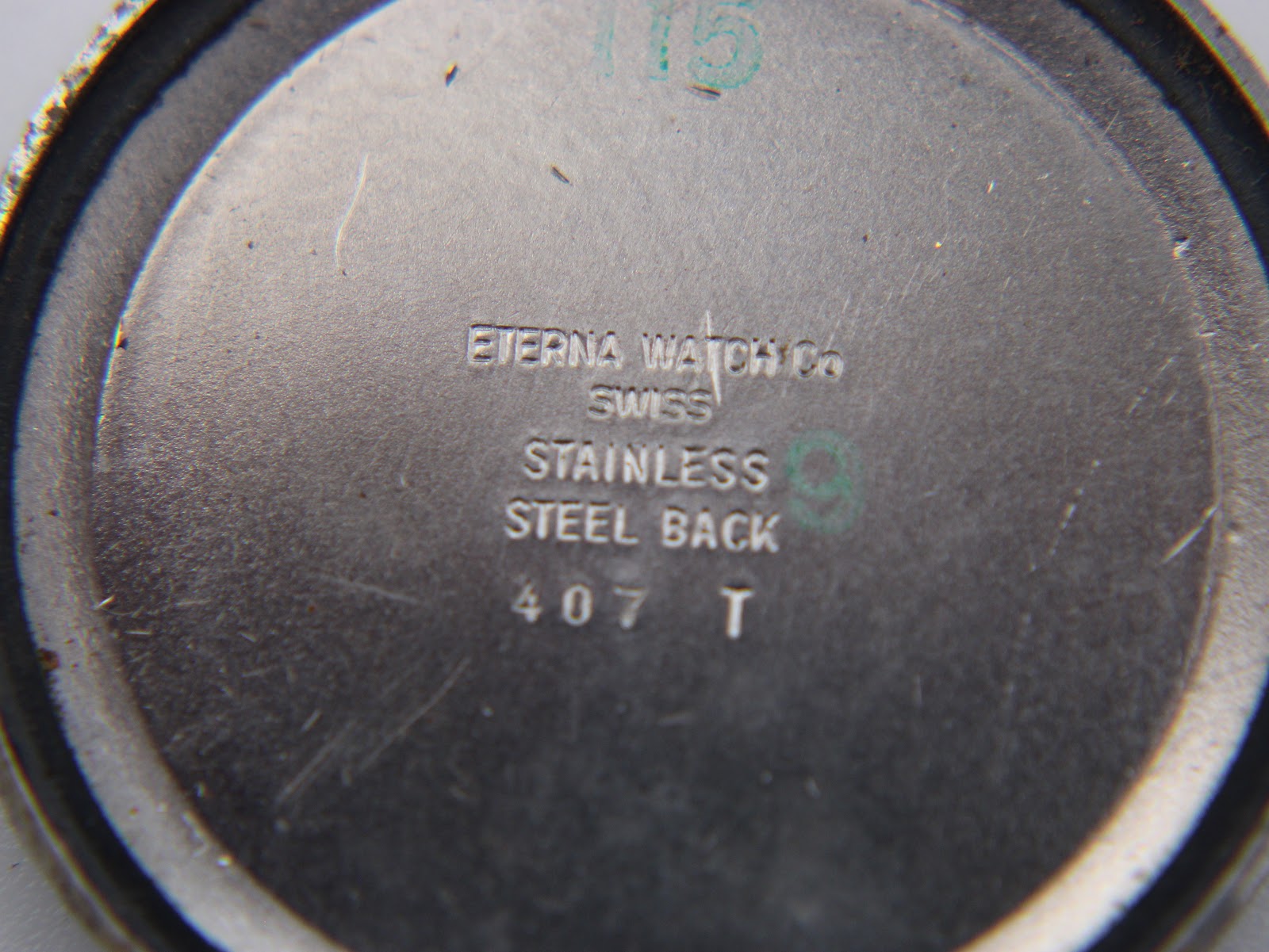 Close-up of the stainless steel case back engraving 'Eterna Watch Co Swiss Stainless Steel Back 407 T'.