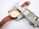 Digital caliper measuring the Eterna watch case diameter, displaying 39.45mm.