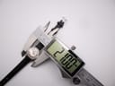 Digital caliper measuring the Certina Certidate watch case diameter, displaying an exact measurement of 21.00 mm.