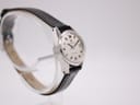 Left side profile view of the Certina Certidate watch on a display stand, highlighting the case shape and black leather strap.