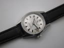 Angled view of the Certina Certidate dial and case, with the black leather strap visible, showcasing the 'Swiss Made' text.