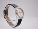 Another angled side view of the Zenith Espada watch, showing the opposite side of the case on a clear watch stand.