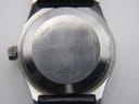 Close-up of the Zenith Espada stainless steel case back, showing 'Surf Stainless Steel' engraving and serial number.