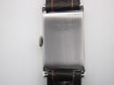 Close-up of the polished stainless steel case back with "FOND ACIER INOXYDABLE" and serial number 3802 engraving.