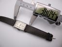 Digital caliper measuring the case width (excluding crown) of the PRONTO watch at 22.00mm, showing the brown leather strap.