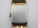 Close-up of the brushed silver-tone case back of the watch, showing the engraved model number '1022' and minor surface scratches.
