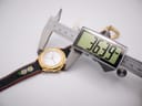A digital caliper measuring the watch case diameter, displaying an exact measurement of 36.39mm.