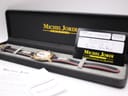 Michel Jordi 1991 Cuvee CH watch in its original black presentation box, alongside the international guarantee card.