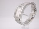 Side view of the Tissot t007309 a watch on a stand, showing the right side of the rectangular case and crown.