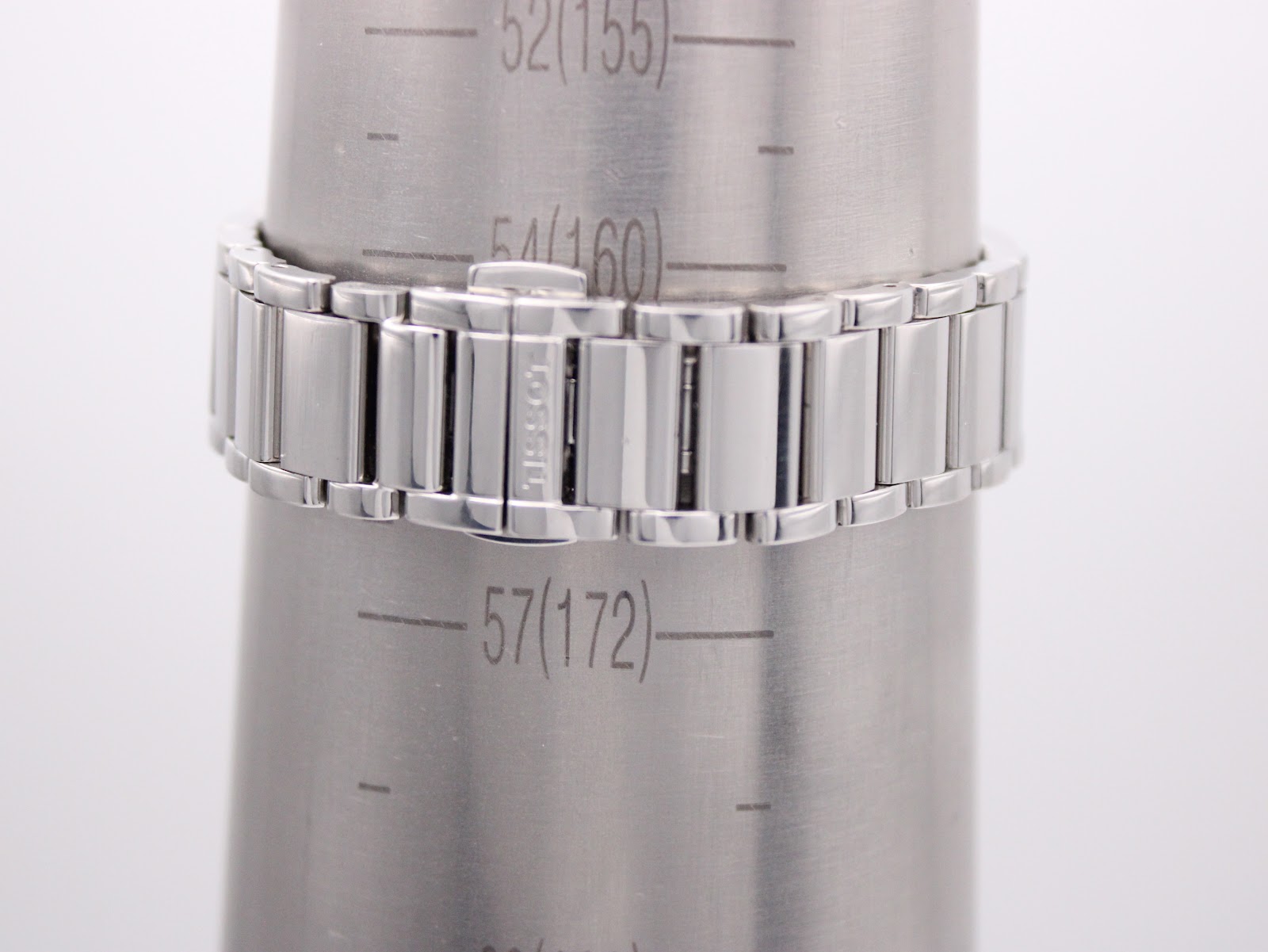 The Tissot watch bracelet on a wrist sizing gauge, showing a measurement of 172mm or 17.2cm wrist circumference.