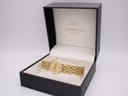 Raymond Weil Fidelio gold watch in its original black presentation box with gold logo.