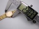 Digital caliper measuring the case diameter of the Raymond Weil Fidelio watch at 23.83mm.