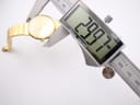 A digital caliper measuring the case diameter of the Michel Herbelin watch, displaying a precise reading of 23.97mm.