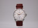 Front view of Certina DS Podium watch with white dial, silver case, and brown leather strap.