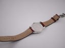 Back view of the Certina DS Podium with the brown leather strap unfurled, showing case back and strap markings.