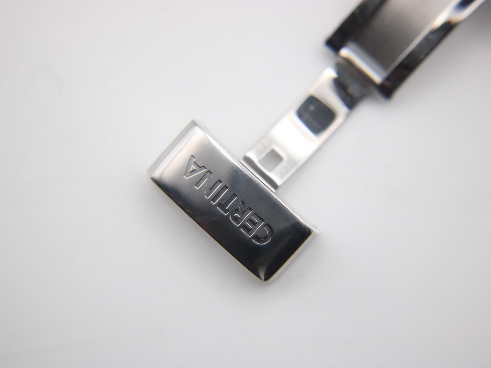 Close-up of the Certina-signed stainless steel deployant clasp.