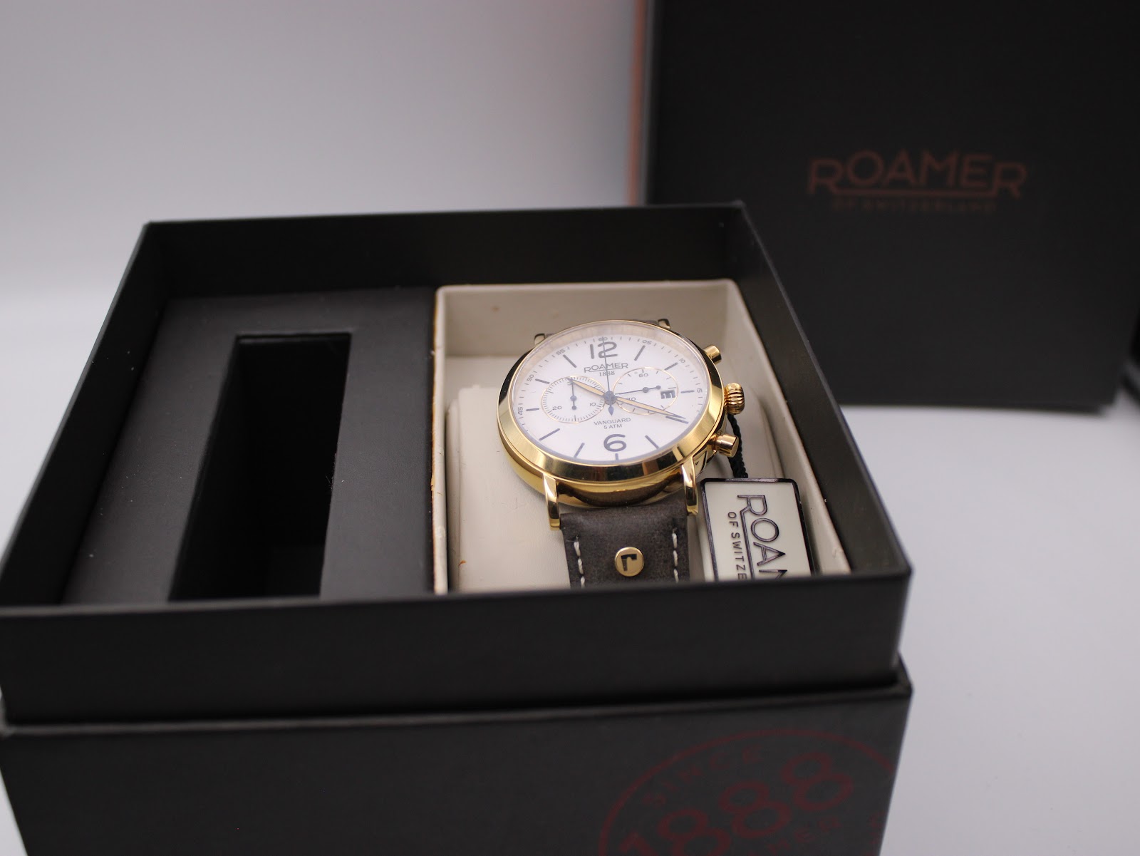 Roamer Vanguard watch inside its original black branded presentation box.