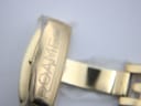 Detail of the gold-toned deployant clasp with "ROAMER" engraved, showing protective plastic film.