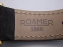 Interior view of the brown leather strap, stamped "ROAMER 1888".
