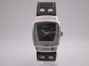 Front view of Hamilton H163110 watch, black textured dial, silver-toned tonneau case, black leather strap with rivets.