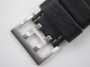 Close-up of the Hamilton branded stainless steel pin buckle on the black leather strap.