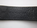 Close-up of the underside of the black leather strap, showing the embossed 'Hamilton' logo.