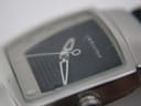Extreme close-up of Hamilton H163110 crystal, showing small scratches on the glass surface.